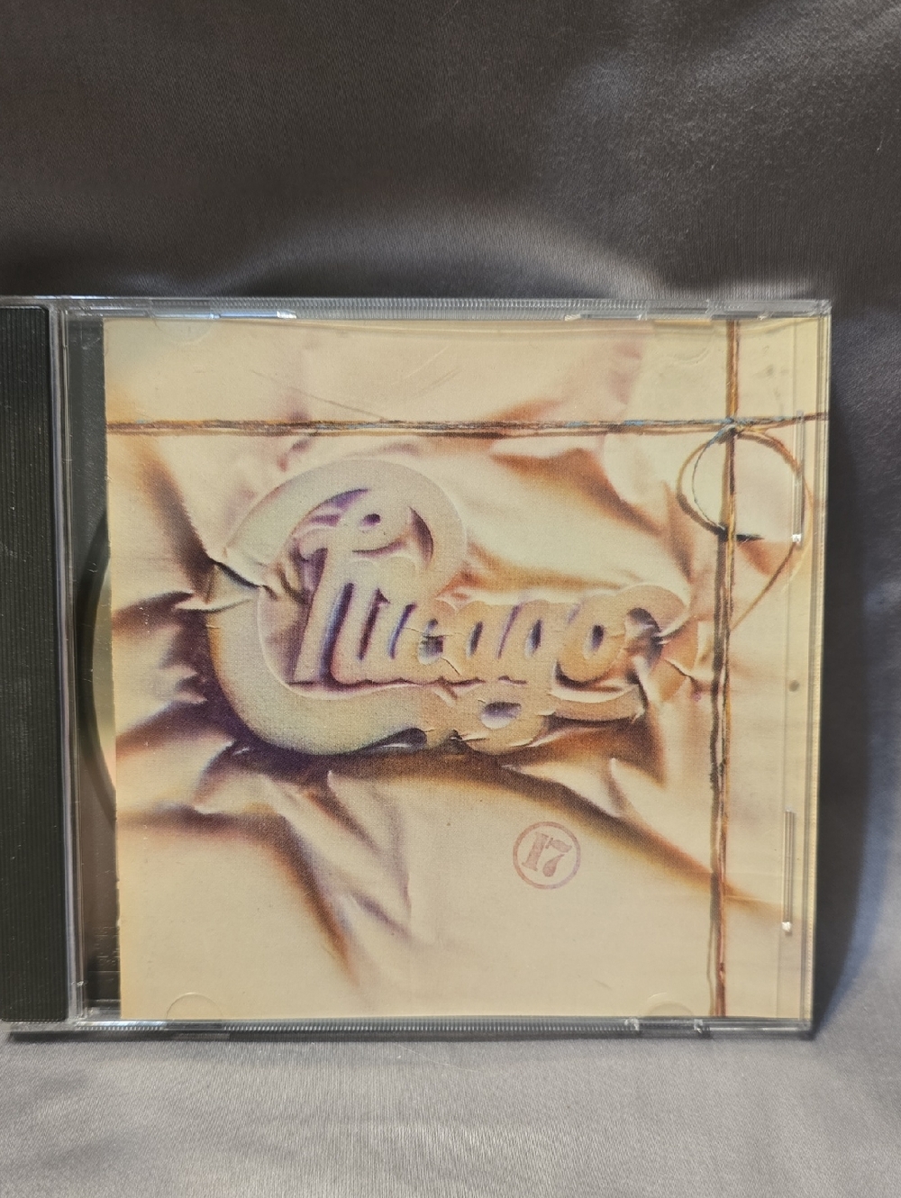 chic cream and purple-styled CD cover‎